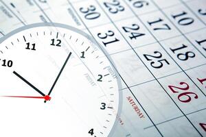 wall calendar with the number of days and clock photo
