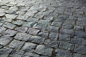 Abstract background of old cobblestone pavement photo