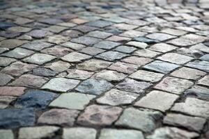 Abstract background of old cobblestone pavement photo