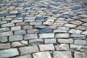Abstract background of old cobblestone pavement photo