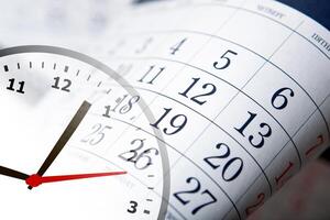 wall calendar with the number of days and clock photo