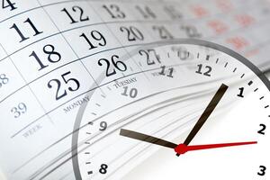 wall calendar with the number of days and clock photo