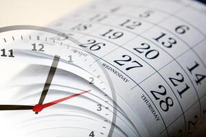 wall calendar with the number of days and clock photo