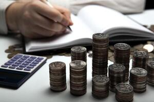 stack of Russian coins on the background of working as an accountant photo