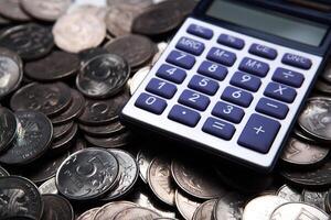 money in the form of coins with calculator photo