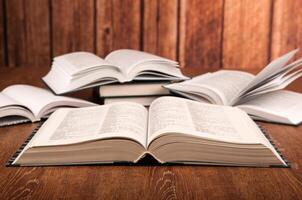 open large book on a wood table photo