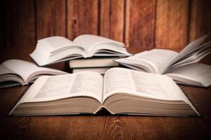 open large book on a wood table photo
