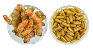 Turmeric root and turmeric capsule powder for alternative medicine ,spa products and food ingredient. photo