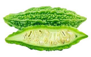 slices of bitter gourd arranged on white background photo