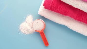 A pile of towels with a spoon and a towel video