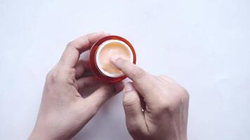 A person holding a red and white circular object video