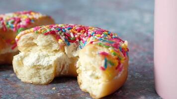 A half eaten donut with sprinkles on it video