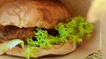 A close up of a sandwich with meat and lettuce video