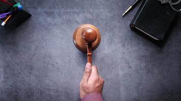 A judge's gavel on a desk with a pen and a notebook video