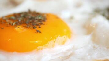 A close up of an egg with herbs on it video