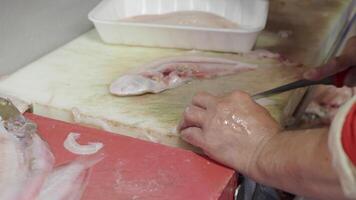 Cleaning fish for further cooking video