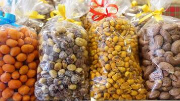 many mixed nuts in a plastic packet on shelf video
