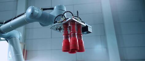Robot arm Automation technology. Tools for saving energy effort and making the work of engineers more convenient in modern factories. Automation factory tech concept with robotic arms lifting goods. photo