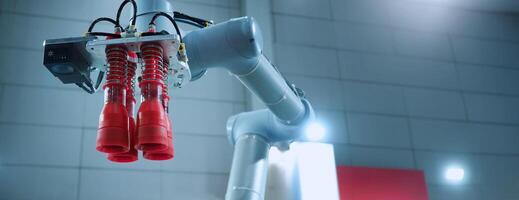 Robot arm Automation technology. Tools for saving energy effort and making the work of engineers more convenient in modern factories. Automation factory tech concept with robotic arms lifting goods. photo