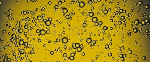 Golden Hyaluron Oil bubbles collagen serum or yellow oil bubbles drop texture background photo