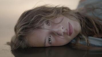 A Serene Girl Quietly Resting Peacefully by the Waters Edge video