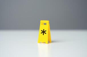 Warning sign with asterisk symbol conditions. Be careful with terms and conditions. Legal red tape and traps. Financial literacy, avoiding debt and not missing out on profits. Avoiding expenses fees photo