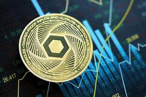 KYIV, UKRAINE - AUGUST 17, 2024 Chainlink LINK coin on abstract fictional candlesticks in trading chart in blue color photo