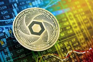 KYIV, UKRAINE - AUGUST 17, 2024 Chainlink LINK coin on cryptocurrency trading chart with calculations in different colors photo