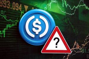 KYIV, UKRAINE - AUGUST 17, 2024 USDC stable coin and red paper question sign on chart background photo