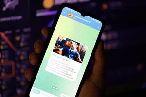 KYIV, UKRAINE - APRIL 20, 2024 Hamster Kombat telegram bot on smartphone screen. Hamster Kombat is a viral Telegram-based crypto game for earn HMSTR tokens by managing virtual crypto exchange photo
