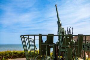 german gun emplacement of second world war on the coast of Arromanches in Normandy photo