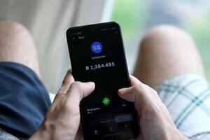KYIV, UKRAINE - APRIL 20, 2024 Blum telegram bot on smartphone screen. Blum is a viral Telegram based crypto game for earn tokens by managing virtual crypto exchange photo
