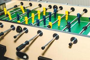 Table soccer. Game figures football players close up. An entertaining game for football fans. photo