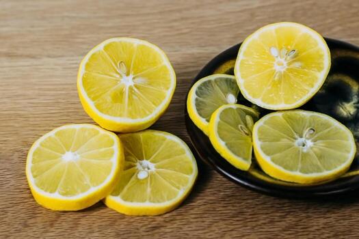 lemon slices neatly cut and lie on a wooden background. space for text photo