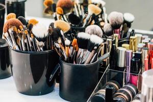 Professional set of make-up brushes ready to work. Cosmetic Close-up brush, powder, set of different objects for makeup artist and cosmetics photo