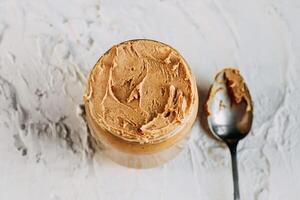 thick peanut butter close-up. Healthy eating photo