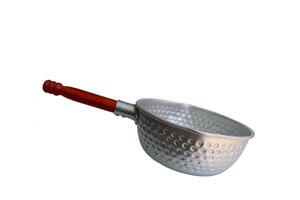 A silver pan with a wooden handle sits on a white background. The pan is empty and has a circular shape photo