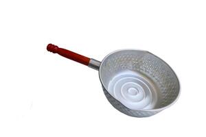 A silver pan with a wooden handle sits on a white background. The pan is empty and has a circular shape photo