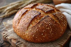 Artisanal Sourdough Bread Loaf with Sesame Seeds on Rustic Burlap - Perfect for Bakery Display, Print, Card, Poster photo