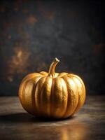 golden pumpkin. squash made of bright gold on a dark background. halloween and thanksgiving concept, free space for text. High quality photo