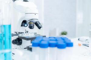 analyze biochemical samples in advanced scientific laboratory. Medical professional use microscope look microbiological developmental of viral. Biotechnology research in science lab. photo