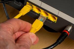 Connecting the device to the Internet using a cable. photo