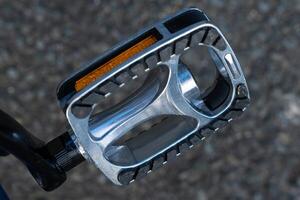 Detail of bicycle components. Road bike pedal. photo