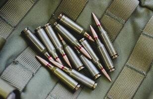Scattered Bullets On A Pocket Of Tactical Backpack photo