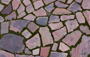 Ancient walking path paved with red granite with straight edges photo