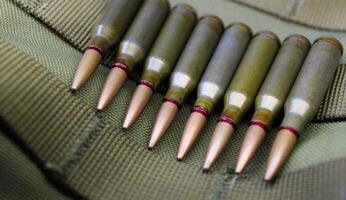 Ammunition in line on the bottom of a military helmet closeup view photo