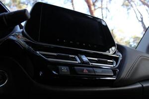 Bottom View Of Switched Off Touch Screen Display In Car Interior photo