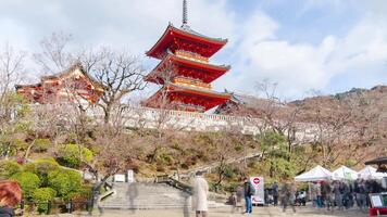timelapse view at pathway in Kiyomizu dera famous tourist attraction temple with red pagoda in Kyoto world heritage with crowded tourist people video