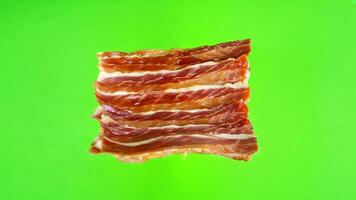 Raw Bacon Strips on green screen background. video