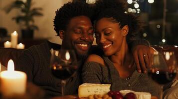 Romantic African American Couple Enjoying Wine and Cheese at Candlelit Dinner photo
